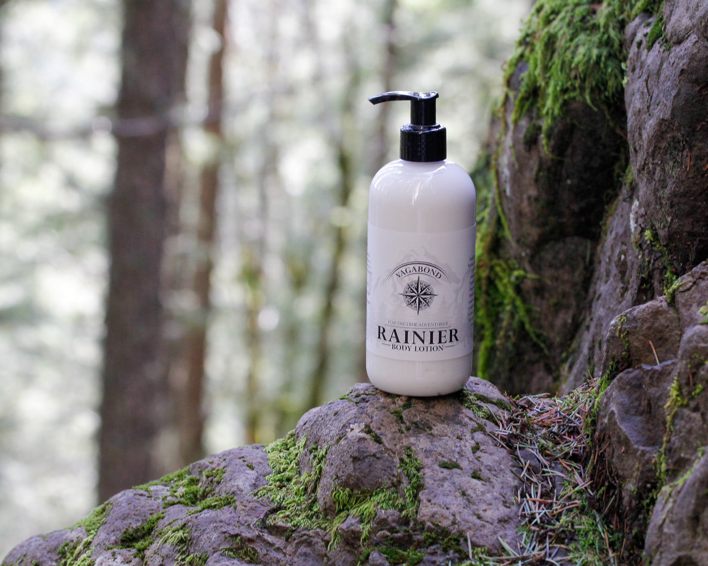 Rainier natural lotion warm cinnamon scent displayed against a mountainside backdrop.