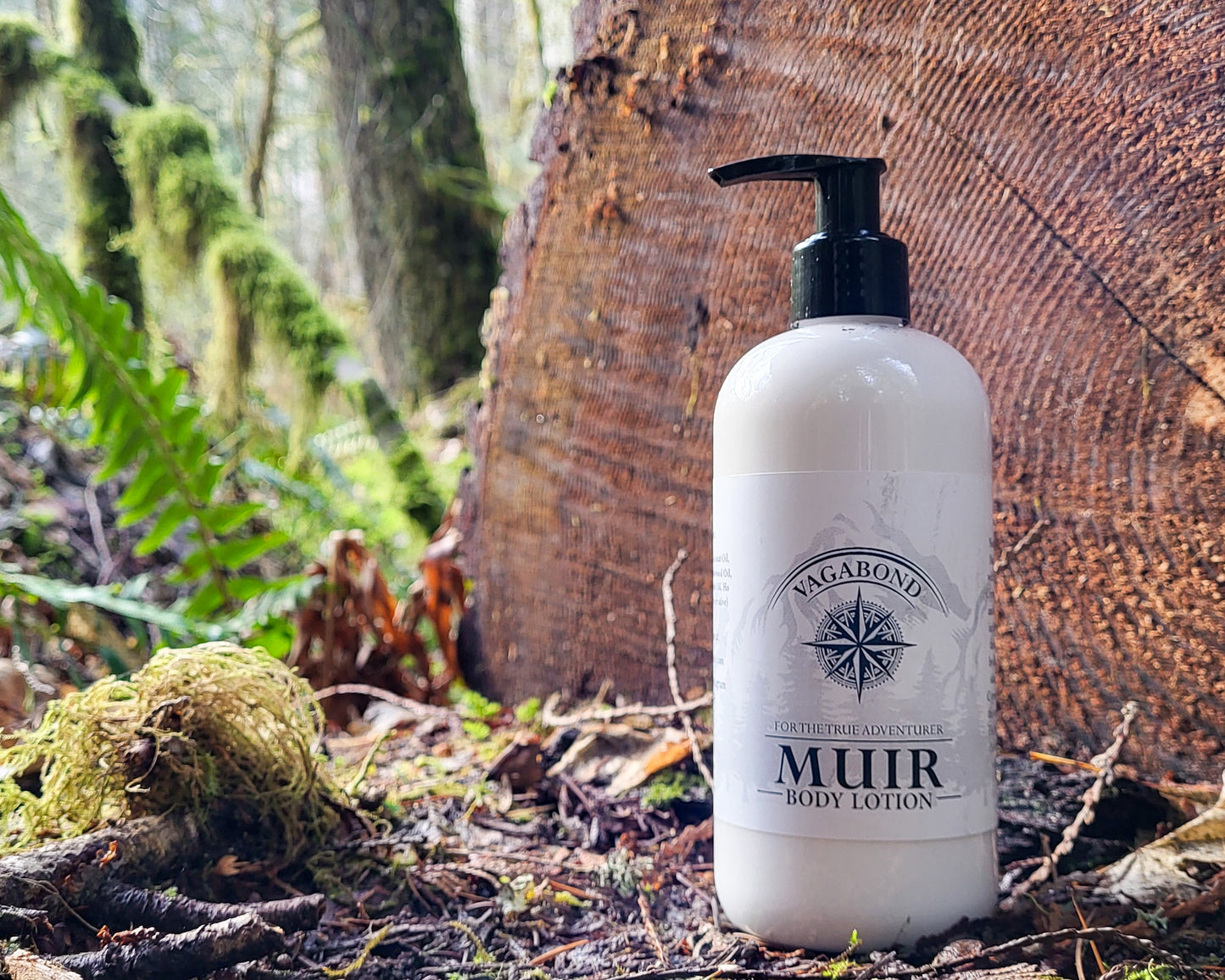 Muir natural lotion evergreen scent displayed on a split log backdrop