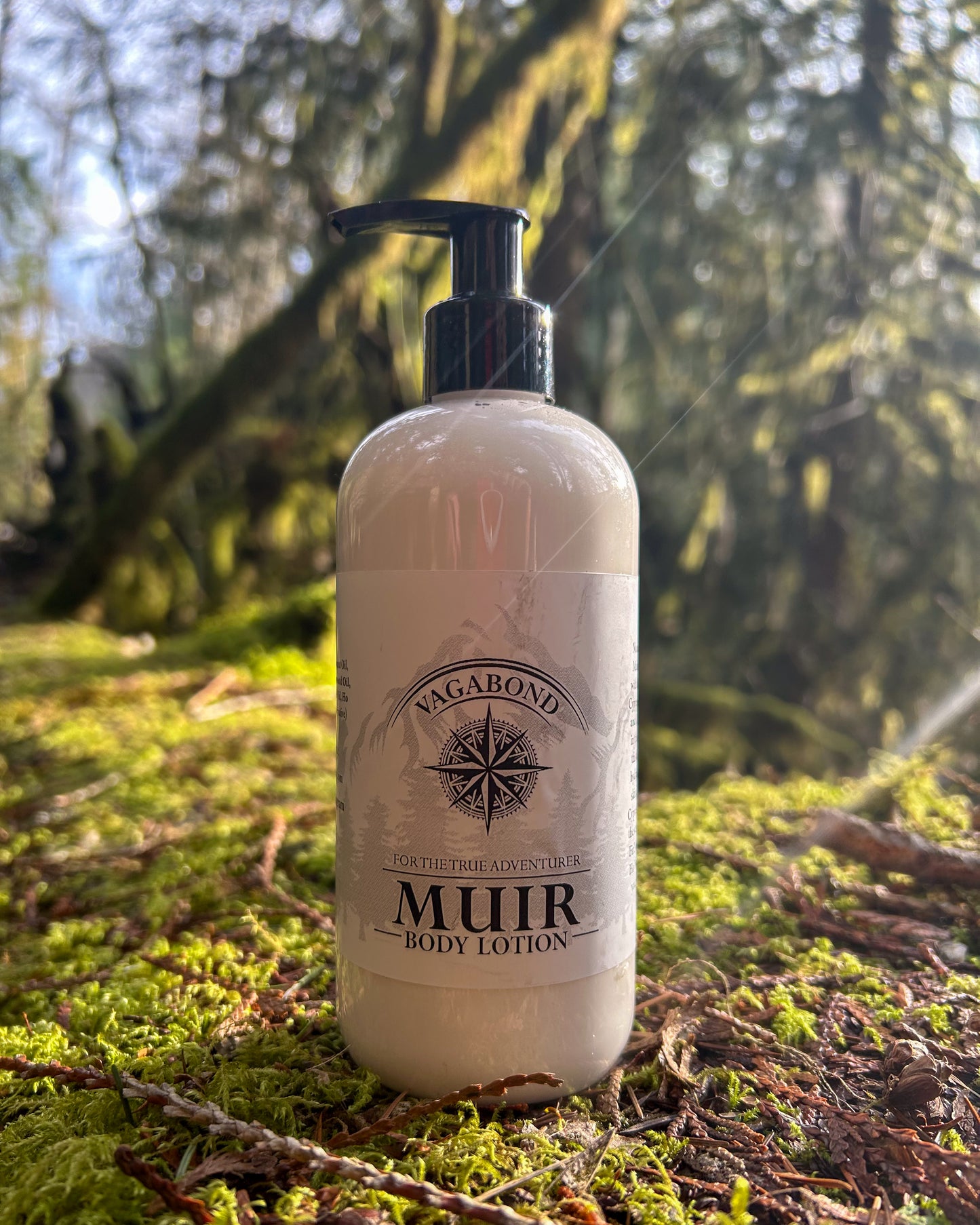 Muir natural lotion evergreen scent displayed on a mossy forest floor