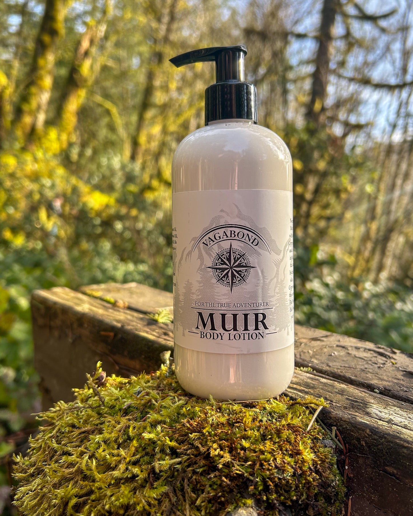 Muir natural lotion evergreen scent displayed on a mossy post backdrop