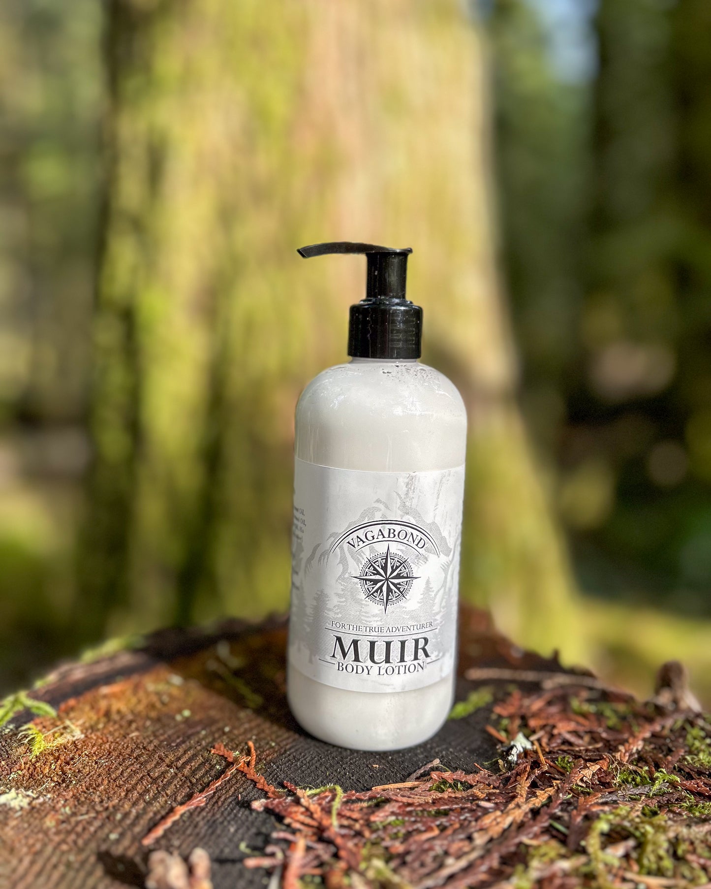 Muir natural lotion evergreen scent displayed on a stump in the woods