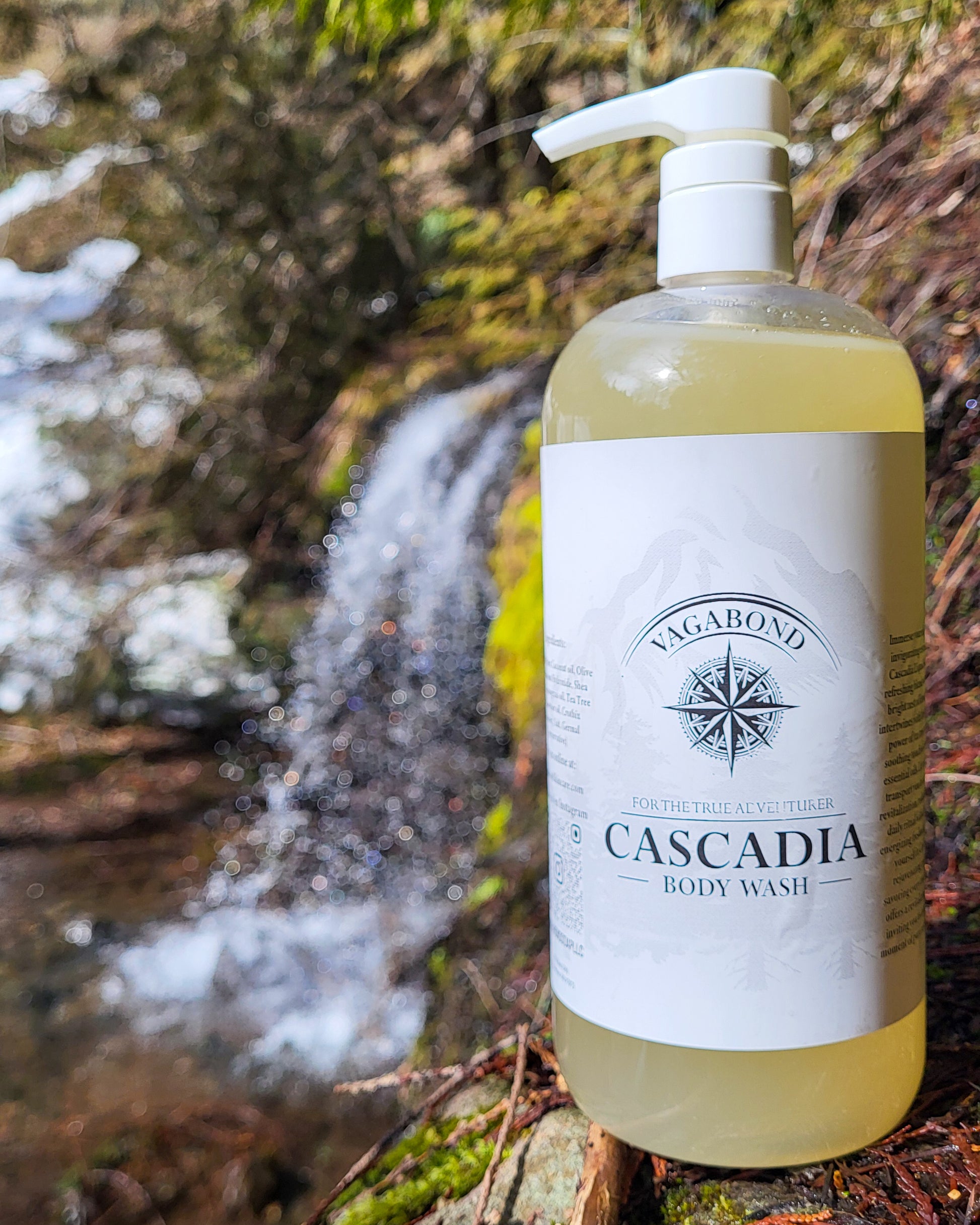 Cascadia natural body wash lemon citrus scent displayed against a blurry waterfall backdrop.